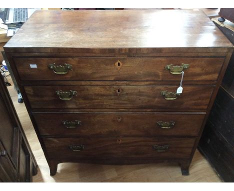 A George III mahogany chest of drawers, fitted with four long graduated drawers, with banding to drawer fronts, raised on spl