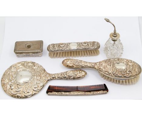 A Victorian style silver mounted dressing table set to include Mirror, comb and two brushes, profuse repousse decoration, by 