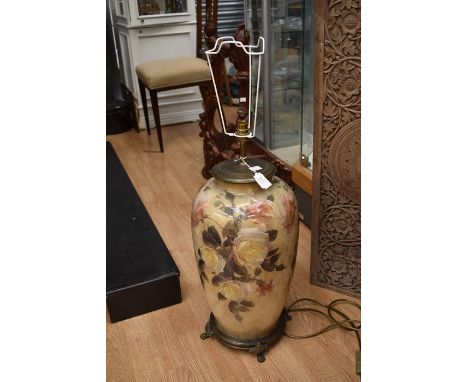 A large contemporary tale lamp with brass mounts, approx 60cm high excluding shade.