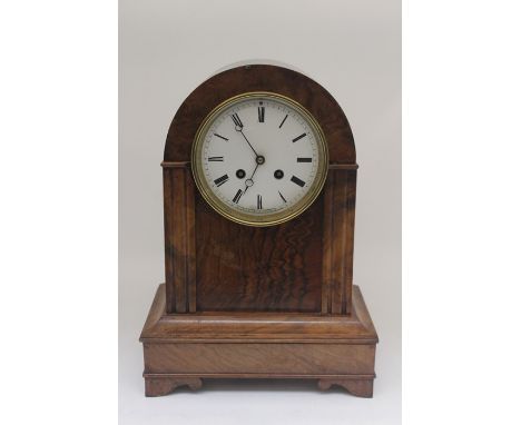 Early to mid 20th Century French walnut mantel clock with 8 day, and Roman numerals