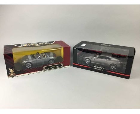 FOUR BOXED MODEL CARS,comprising Kyosho, Minichamps, Revell and Delxue Editions