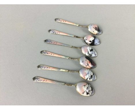 SET OF SIX SILVER-GILT AND ENAMEL COFFEE SPOONSCondition report: Unable to locate a makers mark however photos of markings ad