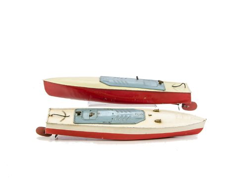 A Trix  Clockwork Boat,  with red hull, white deck and light blue canopy, with additional details, and a Hornby Key, G, winds