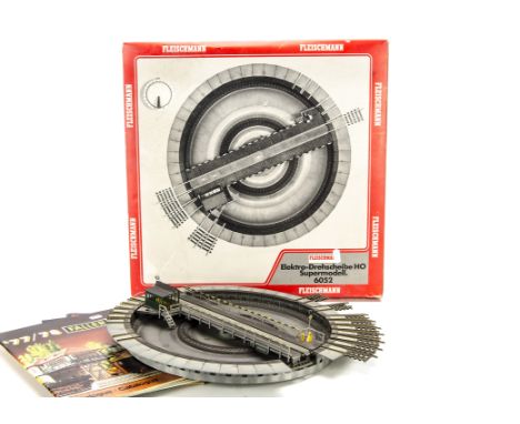 A Fleischmann HO Gauge motorised turntable: with control unit and original box, G-VG, three small edge sections missing, box 
