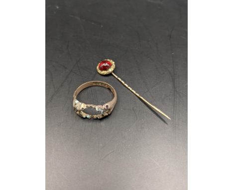 A 9ct gold ring A/F together with a late 19th/early 20th century yellow metal stick pin, testing at 9ct, total weight 2.6gLoc