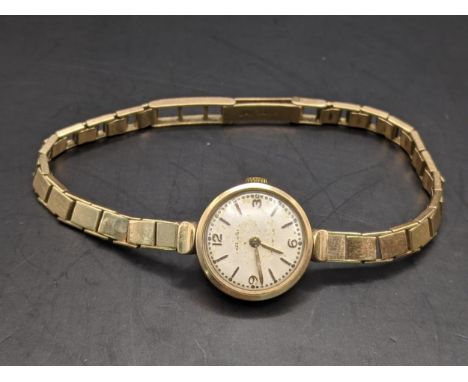 A 9ct gold ladies manual wind watch on a 9ct gold bracelet, 15.8gLocation: 
