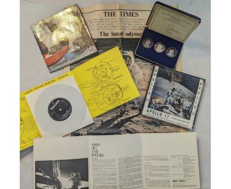 A cased set of three silver medals commemorating man's first landing on the moon, together with two Philips 'Man on the Moon'