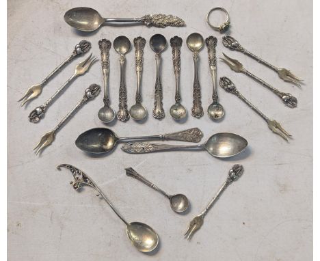 A collection of 925 and other silver spoons to include condiment spoons and pickle forks, along with a white metal ring 105g 