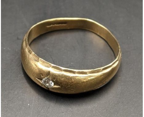 A 9ct gold and diamond gypsy ring, total weight 3.9gLocation: 