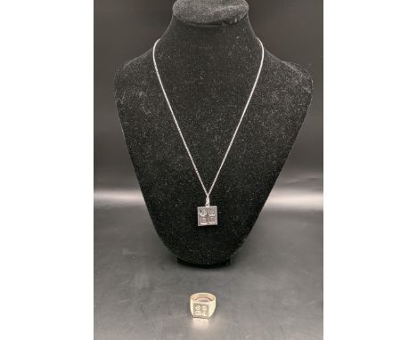 A silver signet ring having hallmarks together with a silver necklace having an ingot pendant, total weight 24.4g 