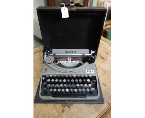 A VINTAGE 'OLIVER' PORTABLE TYPEWRITER in rexine covered case