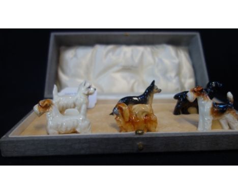 A SET OF SIX ROYAL WORCESTER PLACE CARD HOLDERS, each in the form of a different dog, in a fitted case
