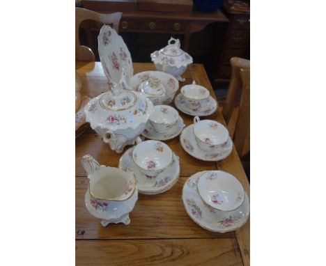 A VICTORIAN TEA SERVICE of scrolling Rococo form with floral decoration