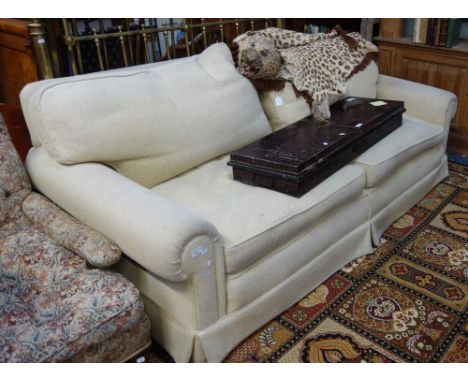 A CREAM THREE SEATER SOFA, 220cm wide