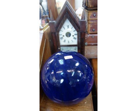 AN AMERICAN 'STEEPLE' SHELF CLOCK by Brewster &amp; Ingrahams, 50cm high and a decorative blue glazed stoneware ball, 28cm di