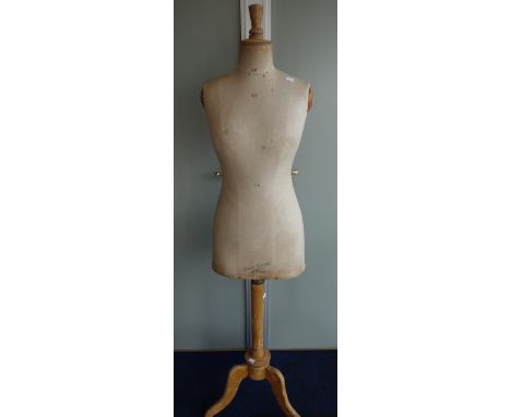 AN EARLY 20TH CENTURY FRENCH DRESS MAKER'S DUMMY 'Buste Girard, Paris' on a wooden tripod stand, 155cm high