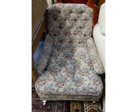 A VICTORIAN OAK FRAMED BUTTON BACK ARMCHAIR
