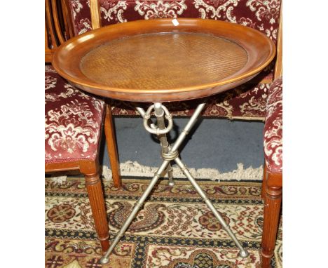 A TRIPOD OCCASIONAL TABLE, with a bamboo effect metal base and dished circular top with crocodile effect centre, 56cm dia