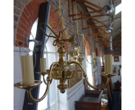 A PAIR OF REGENCY STYLE BRASS THREE BRANCH LIGHT FITTINGS