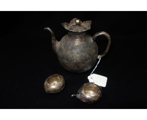 A JAPANESE SILVER TEAPOT, Meiji period, melon form, pull-off cover with flower bud finial, decorated with peonies and chrysan