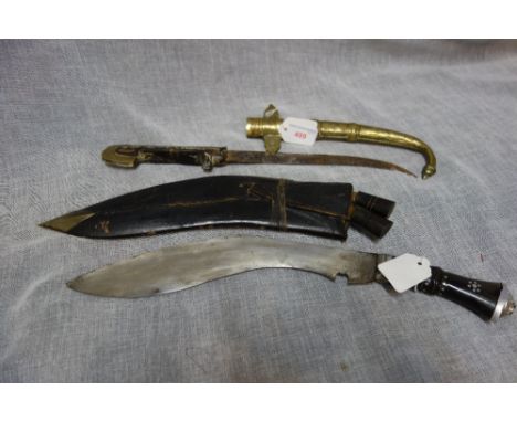 A TURKISH DAGGER, with brass and wood handle, brass engraved scabbard, and a Kukri in original leather scabbard