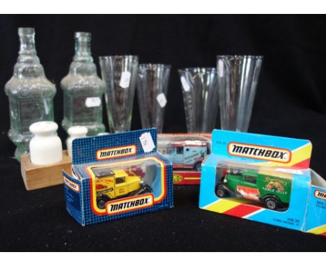 A SET OF VINTAGE CERAMIC APOTHECARY WEIGHTS, four glass measures, two glass bottles and three collector's model cars