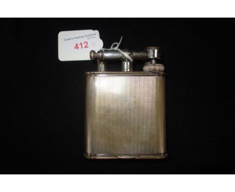 DUNHILL: A LARGE NOVELTY SILVER PLATED TABLE LIGHTER, with engine turned panels, patent no. 390107, reg no. 737418, 10.5cm hi