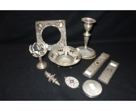 A COLLECTION OF MIXED SILVER, comprising a single silver candlestick (filled), an Edwardian art nouveau silver mounted photog