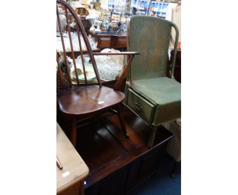 AN ERCOL ARMCHAIR (with later wheels) a reproduction oak coffer and a Lloyd loom (style) chair (3)