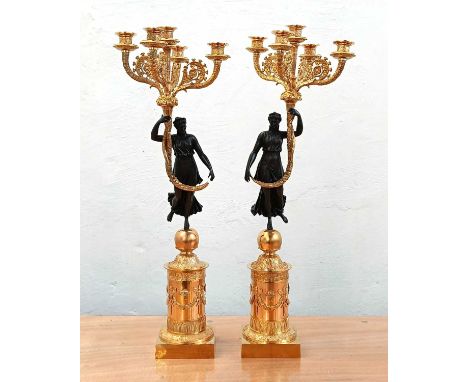 A pair of Empire style gilt metal and bronze figural table candelabra, each h.70cm