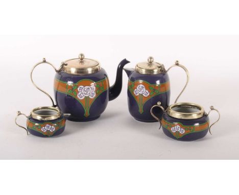 A four piece tea service, enamel decorated with the Glasgow rose in the suffragette colours, having metal mounts (4)