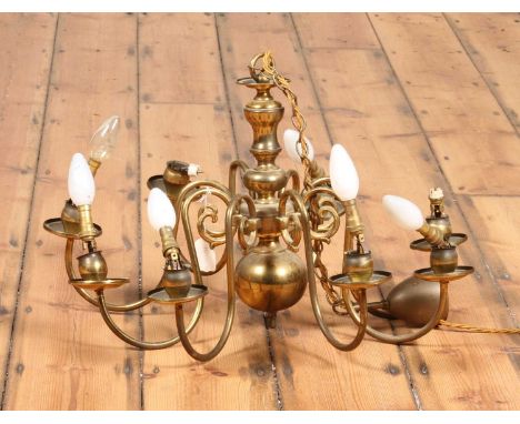 A Dutch style eight brass candelabra, h.35cm