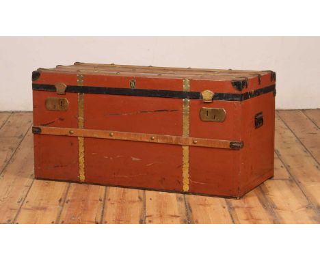 A vintage red painted metal travelling trunk/coffee table, h.50 x w.100 x d.48cm