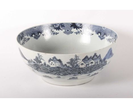A large Chinese blue and white porcelain punch bowl, Qianlong period (1736-1795), the exterior decorated with a mountain land