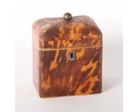 A George III tortoiseshell and ivory single-compartment tea caddy, of square shape, having a brass ball finial, h.14cmThis lo