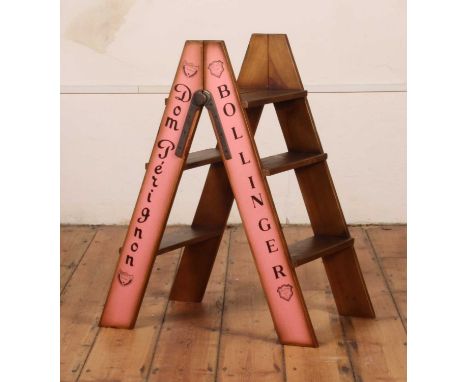 A wooden stepladder, inscribed Dom Perignon Bollinger, h.81 x w.44 x d.65cm