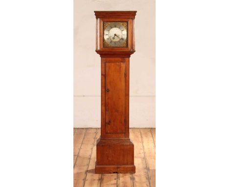 A George III pine longcase clock, circa 1800, having a 10¾" square brass dial with silvered centre engraved with a river land