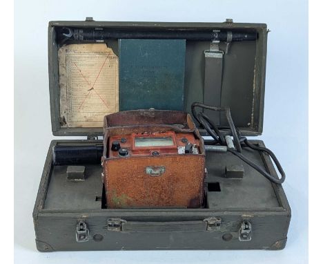 A Polish DP-66M Geiger counter, circa 1972, with leather carrying case, manual, and probe, in a wooden box, 11 x 18 x 19cm