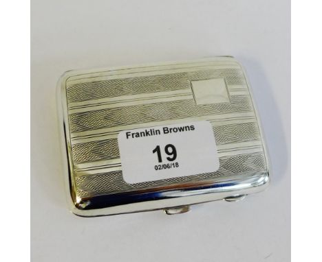 An Art Deco silver cigarette case with chevron engine turned pattern, Birmingham 1934 