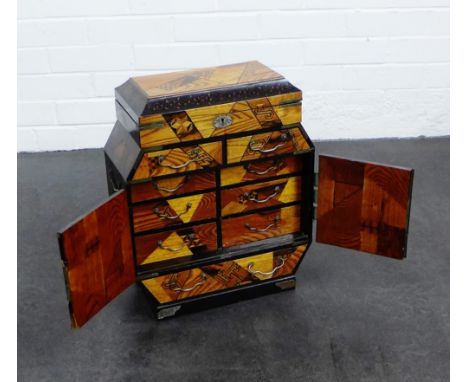 An oriental inlaid cabinet, with lift up top and pair of doors which open to reveal six internal drawers,  44 x 36cm 