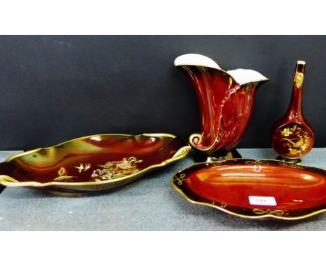 A group of Carlton Ware Rouge Royale pottery to include an oval 'Pagoda' patterned dish, a small bottle neck vase and a cornu