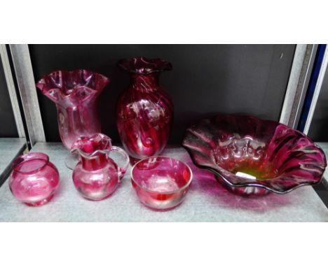 A collection of cranberry and ruby glass to include a bowl, vases and small jug etc., (6) 