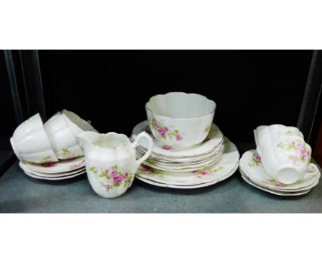 A Staffordshire porcelain floral pink rose patterned teaset, comprising six cups, six saucers, six side plates, sugar bowl, m