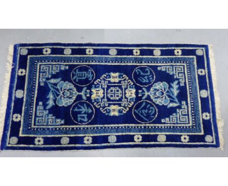 Chinese style small carpet commissioned by Ma Hushan (1910 - 1954) circa 1930, the blue ground with four bats pattern and peo