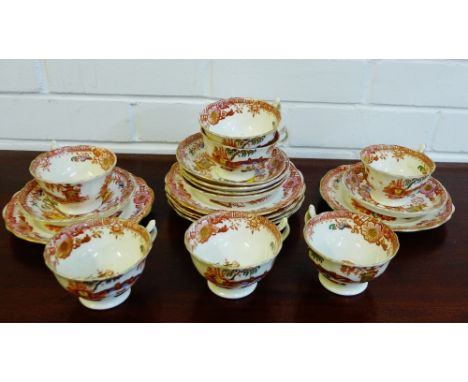 A Staffordshire 'Chinoiserie' patterned teaset, comprising seven cups, six saucers and six side plates