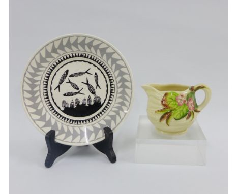 Scottie Wilson for Royal Worcester, black and white glazed plate, 17cm diameter,  together with a Clarice Cliff fruit moulded