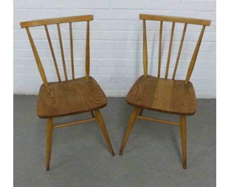 A pair of vintage Ercol beech and elm stick back chairs with solid seats and turned tapering legs, 39 x 79cm (2) 