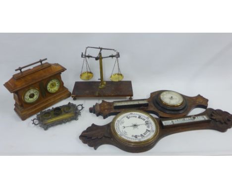 An oak wall barometer, rosewood and inlaid wall barometer, walnut desk barometer and various small sets of scales and an inkw