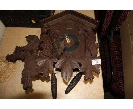 A CARVED BLACK FOREST STYLE CUCKOO CLOCK A/F