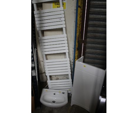 AN ELECTRIC RADIATOR TOGETHER WITH A BATHROOM CUPBOARD UNIT AND A BASIN